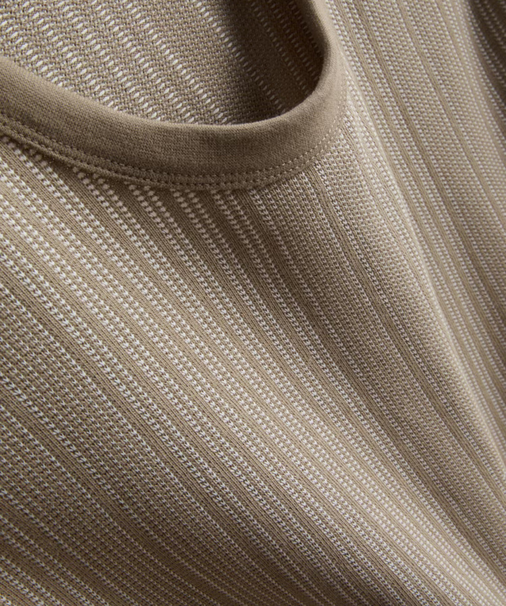 A pair of textured long pyjamas with a shortsleeved top and drawstring bottoms