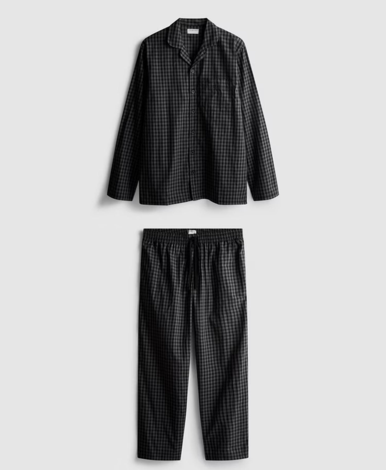A pair of check pyjamas with long sleeve top and bottoms