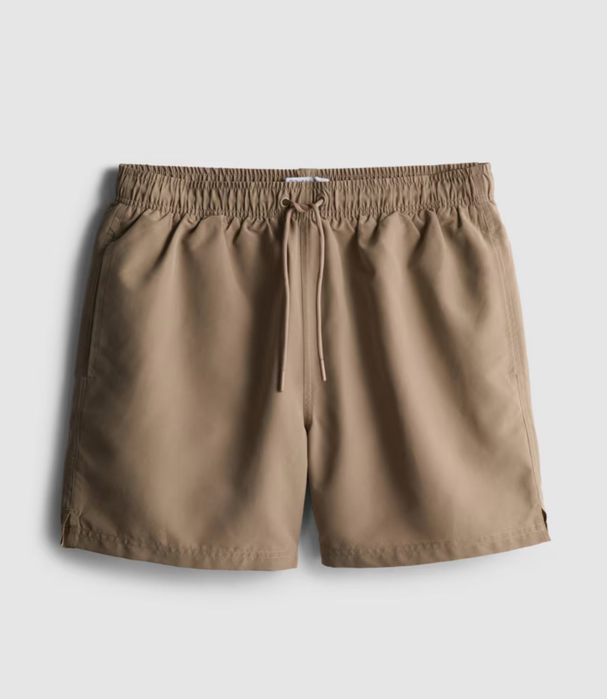 A pair of microfibre swimming shorts with drawstring waistline, and inner mesh