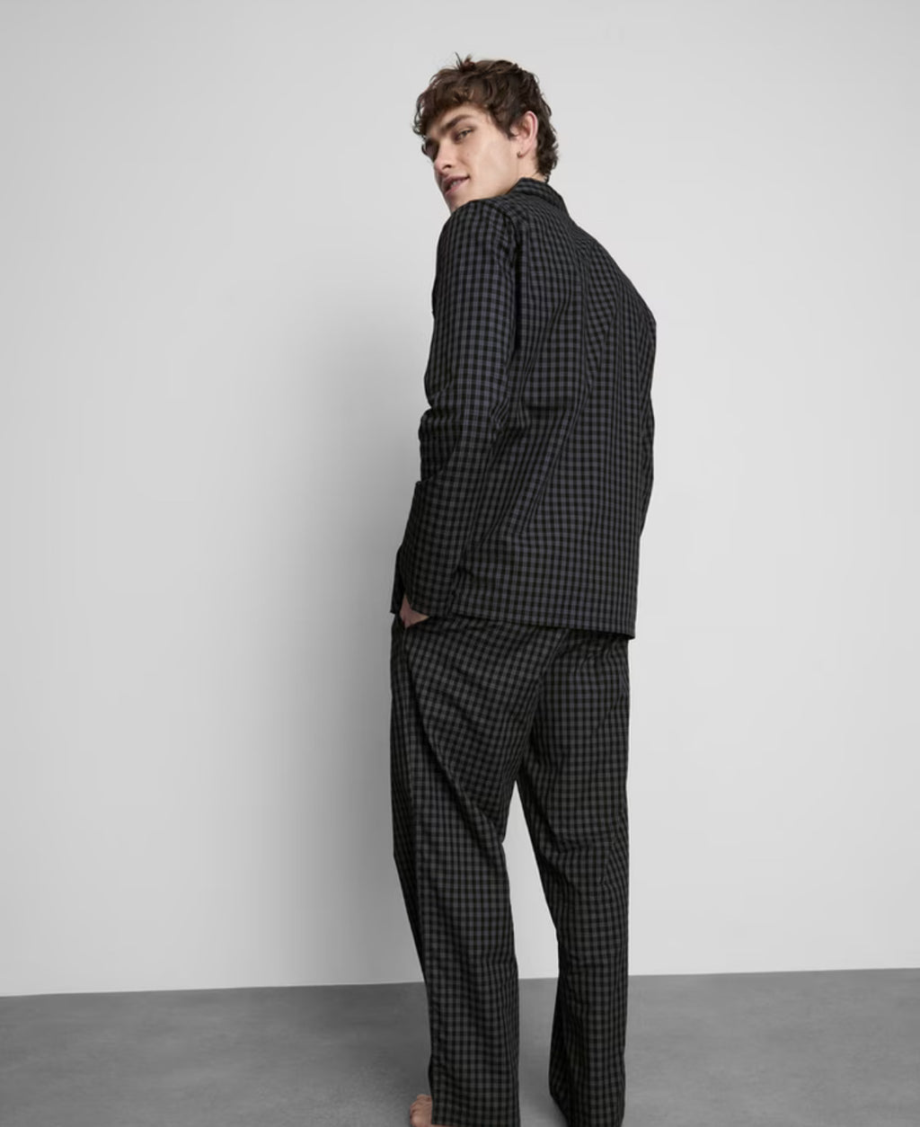 A pair of check pyjamas with long sleeve top and bottoms