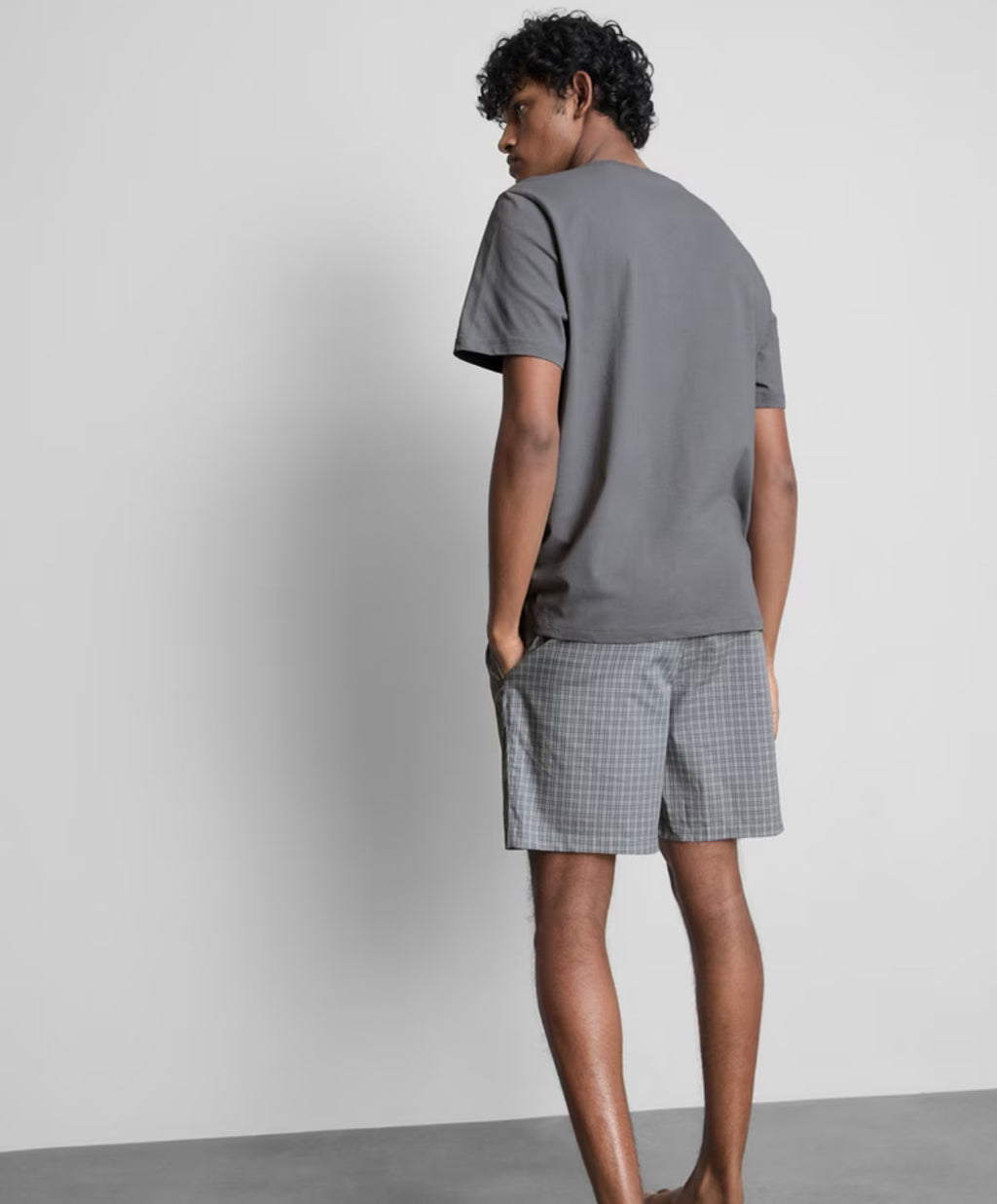A pyjama set with short sleeves and check shorts