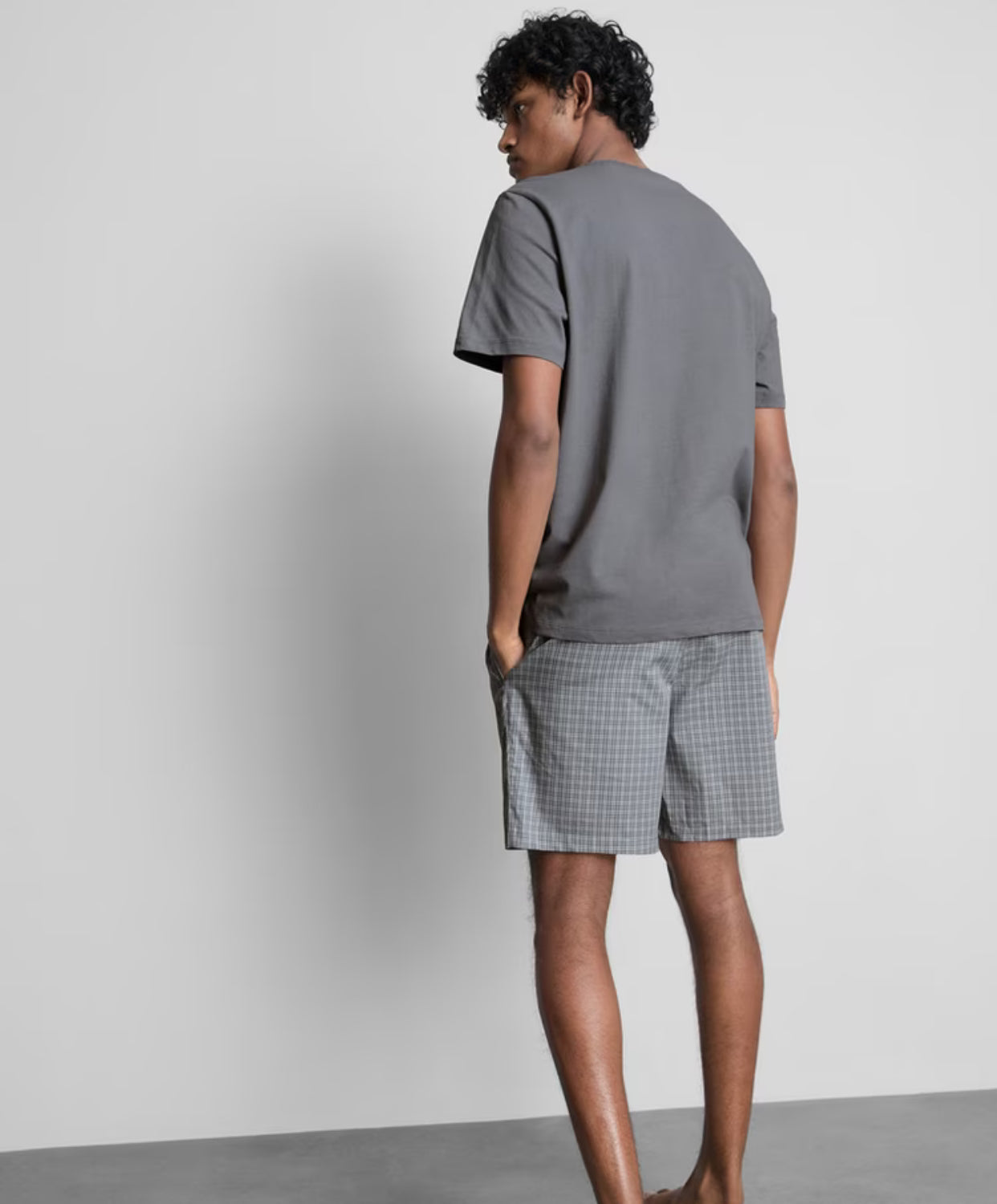 A pyjama set with short sleeves and check shorts