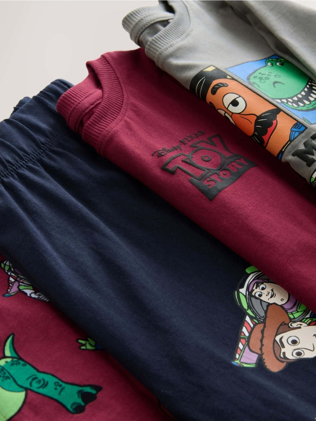 Multi Toystory Snuggle Pyjamas 
2Pack