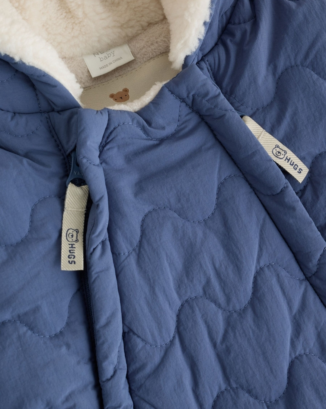 Blue Quilted Hooded Nylon Baby
All-In-One