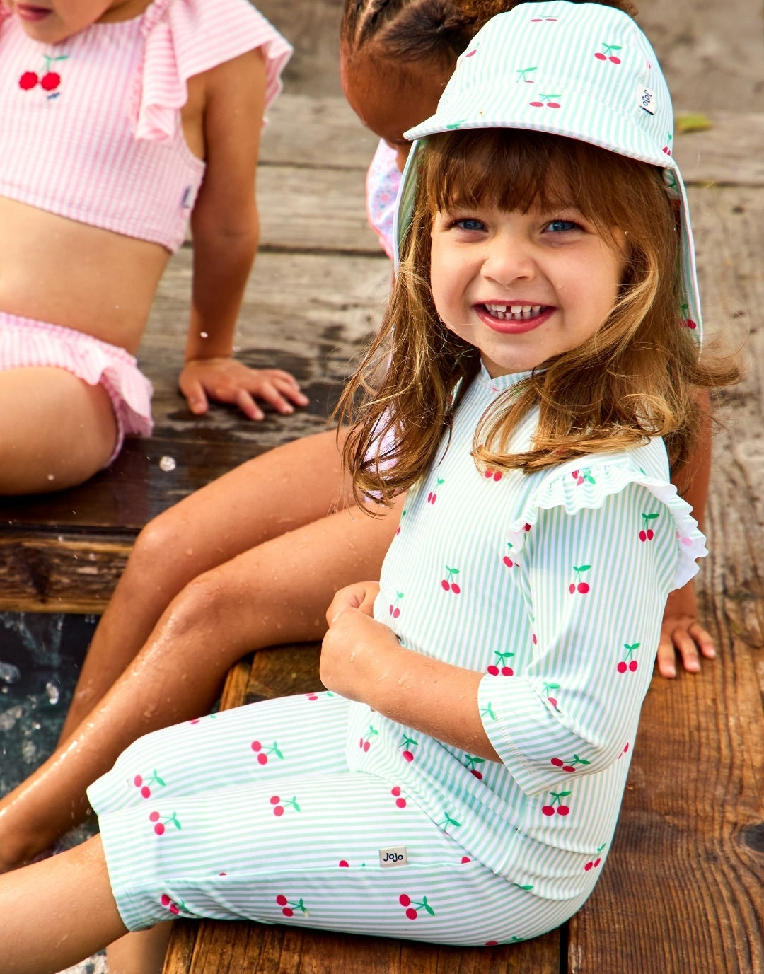 JoJo Maman Bébé Green Cherry
Stripe UV Sunsafe Suit