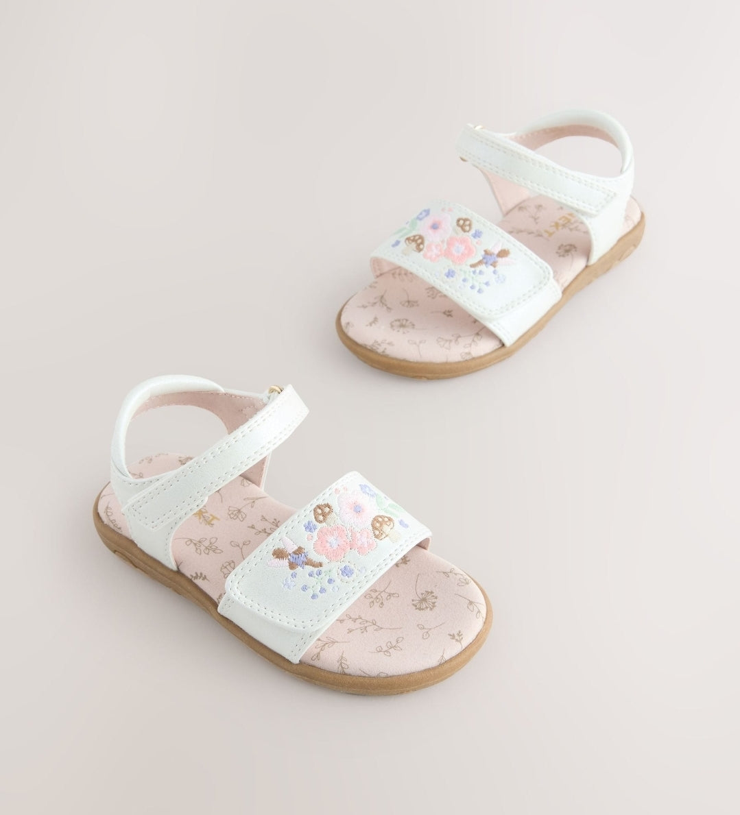 White Embroidered Touch
Fastening Sandals